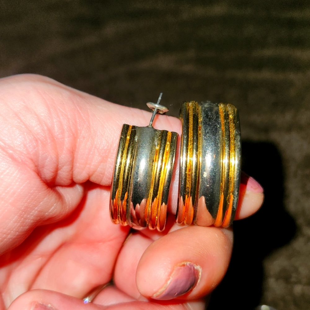 Gold and silver ear rings.